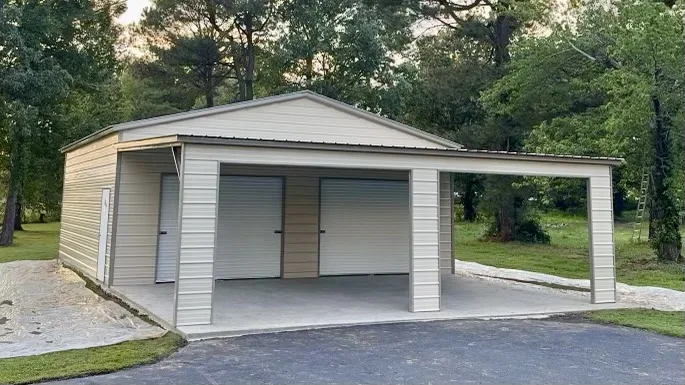 Beige two-door metal garage with an open carport on the front