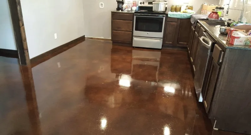 Glossy brown stained concrete floor in a finished kitchen