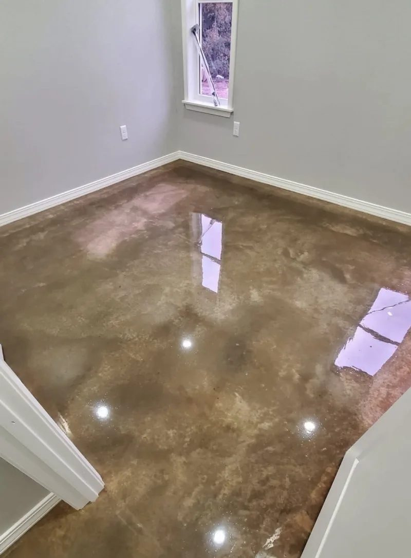 Stained and sealed concrete floor in a freshly painted room